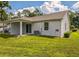Spacious backyard features a covered patio and a well-maintained lawn at 2503 Se 18Th Cir, Ocala, FL 34471