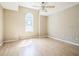 Light-filled bedroom with vaulted ceiling features a window and ceiling fan with a light at 2503 Se 18Th Cir, Ocala, FL 34471