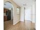 Bright entryway with wood floors leads to kitchen and dining area at 2503 Se 18Th Cir, Ocala, FL 34471