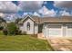 Charming home features a well-maintained lawn and attached one car garage at 2503 Se 18Th Cir, Ocala, FL 34471