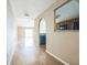 Hallway view leads into an open living area and adjacent kitchen at 2503 Se 18Th Cir, Ocala, FL 34471