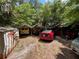 Backyard parking area with several vehicles and carports at 2520 Raehn St, Orlando, FL 32806