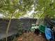 Backyard view of the property showing a tarp on a chainlink fence at 2520 Raehn St, Orlando, FL 32806
