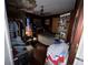 Dilapidated bedroom features a bed, ceiling damage, open closet, and assorted clutter, suggesting need for extensive renovation at 2520 Raehn St, Orlando, FL 32806