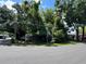 Overgrown property with RVs and lush greenery create a unique and private outdoor space at 2520 Raehn St, Orlando, FL 32806