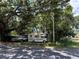 Property featuring mature trees with an RV, truck, and van parked under the shade, creating a natural carport at 2520 Raehn St, Orlando, FL 32806