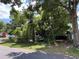 Overgrown property with lush, mature trees and vegetation offers privacy and a natural setting at 2520 Raehn St, Orlando, FL 32806