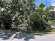 Mature trees with an RV, truck, and van parked under the shade, creating a natural carport at 2520 Raehn St, Orlando, FL 32806