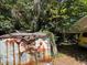 Backyard shed and vehicles behind the shed at 2520 Raehn St, Orlando, FL 32806