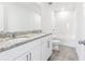 A bathroom featuring double vanity sinks, shower over tub, and granite countertops at 2774 Virginia Pine Dr, Bartow, FL 33830