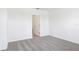 Bright, carpeted bedroom showcases neutral walls and trim, and a door to the hallway at 2774 Virginia Pine Dr, Bartow, FL 33830