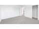 A standard bedroom with neutral carpet and access to an ensuite bath at 2774 Virginia Pine Dr, Bartow, FL 33830