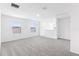 An upstairs bonus room, naturally lit with neutral carpet at 2774 Virginia Pine Dr, Bartow, FL 33830