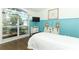 Bright bedroom with a large window, wood floors, and charming cottage decor at 304 Little Springs Ln, Longwood, FL 32750