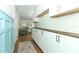 Bright hallway with a long countertop and open doorway to the living room at 304 Little Springs Ln, Longwood, FL 32750