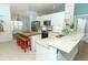 Charming kitchen features a wooden table island and white cabinets at 304 Little Springs Ln, Longwood, FL 32750