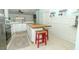 Bright and spacious kitchen featuring a wooden island and tiled floors at 304 Little Springs Ln, Longwood, FL 32750