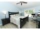 Bedroom with a ceiling fan, and a window bringing in natural light at 304 Little Springs Ln, Longwood, FL 32750