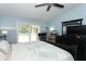 Spacious bedroom with a ceiling fan and views of the exterior at 304 Little Springs Ln, Longwood, FL 32750