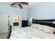 Bedroom with an ensuite bathroom, ceiling fan, and natural light at 304 Little Springs Ln, Longwood, FL 32750