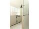 Modern shower featuring a glass block window, hand shower, and glass partition at 304 Little Springs Ln, Longwood, FL 32750