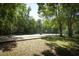 Community tennis and basketball courts surrounded by mature trees, perfect for outdoor activities at 304 Little Springs Ln, Longwood, FL 32750