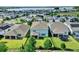 Aerial view of a home in a neighborhood provides perspective on backyard, landscaping, and community layout at 3259 Buoy Cir, Winter Garden, FL 34787