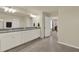 Bright bathroom with a tiled floor, granite countertops, dual sinks, and a view towards the bedroom at 3259 Buoy Cir, Winter Garden, FL 34787