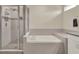 Bright bathroom features a tiled floor, a soaking tub, and walk-in shower at 3259 Buoy Cir, Winter Garden, FL 34787