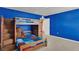 A charming bedroom with a wooden bunk bed offers a cozy and playful space, featuring carpeted floors at 3259 Buoy Cir, Winter Garden, FL 34787
