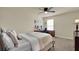 Cozy bedroom with neutral colors, a window with blinds, and a desk with computer and chair at 3259 Buoy Cir, Winter Garden, FL 34787