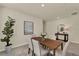 Inviting dining area with a dark wood table, fabric chairs, and elegant decor at 3259 Buoy Cir, Winter Garden, FL 34787