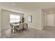 Bright dining room featuring a modern table and chairs, complemented by a decorative rug at 3259 Buoy Cir, Winter Garden, FL 34787