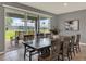 Dining area with large sliding glass doors opening to the backyard patio, and a large table with chairs at 3259 Buoy Cir, Winter Garden, FL 34787