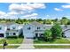 Aerial view of a charming two-story home with a well-manicured lawn and inviting front entrance at 3259 Buoy Cir, Winter Garden, FL 34787