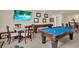 Upper game room showcases a pool table and shuffle board for recreation and entertaining at 3259 Buoy Cir, Winter Garden, FL 34787