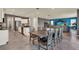 Open-concept living area features a kitchen, dining area, and living room in a modern design at 3259 Buoy Cir, Winter Garden, FL 34787