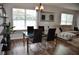 Dining area includes a glass top table with seating for four and an open floor plan at 3416 Seneca Club Loop # 56, Orlando, FL 32808