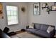 Comfortable living area with a gray sofa, stylish pillows, and modern decor at 3416 Seneca Club Loop # 56, Orlando, FL 32808