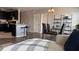 Open-concept living space showcases wood floors, comfortable sofa, dining area, and view of kitchen at 3416 Seneca Club Loop # 56, Orlando, FL 32808