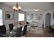 Cozy living room with a dining area, couch, and décor at 3416 Seneca Club Loop # 56, Orlando, FL 32808