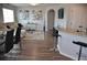 Bright living room featuring wood flooring, comfortable seating, stylish decor, and a kitchen breakfast bar at 3416 Seneca Club Loop # 56, Orlando, FL 32808