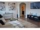 Inviting living room with neutral tones, wood floors, modern decor and a view to the dining area at 3416 Seneca Club Loop # 56, Orlando, FL 32808