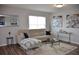 Bright living room features a comfortable couch, stylish décor, and neutral color palette at 3416 Seneca Club Loop # 56, Orlando, FL 32808