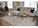 Living room area complete with a couch, area rug, and natural light at 3416 Seneca Club Loop # 56, Orlando, FL 32808