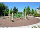 Fun community playground with climbing structures and safety mulch, surrounded by trees and landscaping at 3416 Seneca Club Loop # 56, Orlando, FL 32808