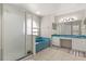 Spacious bathroom with a soaking tub, glass-enclosed shower and double sink vanity at 386 Riggs Cir, Davenport, FL 33897