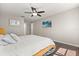 Cozy bedroom featuring a plush bed with decorative pillows and contemporary wall art at 386 Riggs Cir, Davenport, FL 33897