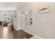Bright and inviting foyer featuring hardwood floors, staircase, and stylish decor at 386 Riggs Cir, Davenport, FL 33897