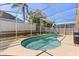 Sparkling screened-in pool offers a refreshing escape on a sunny day at 386 Riggs Cir, Davenport, FL 33897